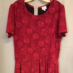 Red LuLaRoe dress in good condition. There are a few pulls but barely noticeable